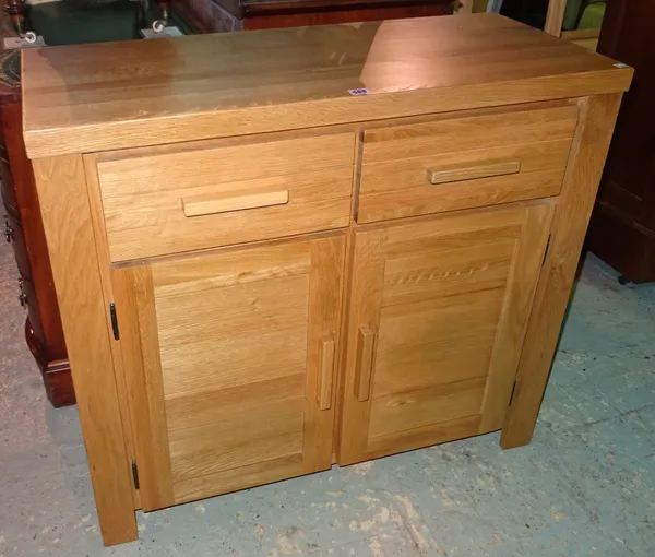 A 20th century oak side cabinet with two drawers over cupboard base, 93cm wide x 84cm high.  H8