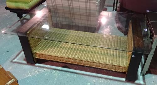 A 20th century rectangular glass top coffee table on mahogany and rattan base, 128cm wide x 44cm high.  J8