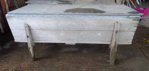 A late 19th elm dough bin with later added zinc lining on trestle end supports, 193cm wide x 72cm high.  OUT