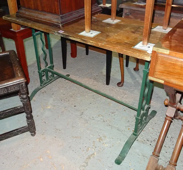An early 20th century cast iron side table with pine top, 99cm wide x 70cm high.  I5