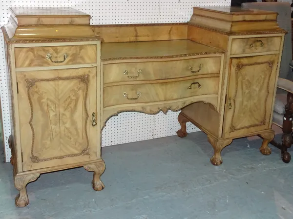 A 20th century bleached mahogany stepped twin pedestal sideboard on ball and claw feet, 195cm wide x 105cm high.   ROST