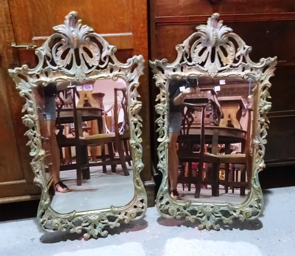 A pair of 20th century parcel gilt and verdigris Italian style mirrors, 50cm wide x 80cm high (2). MIRR
