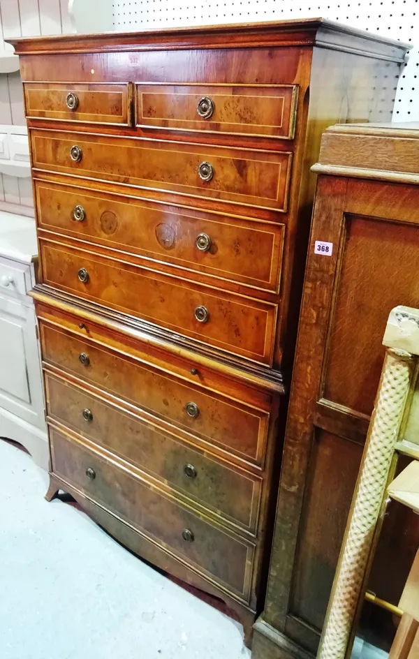 A 20th century yew wood chest on chest with two short drawers over six long graduated drawers, 83cm wide x 142cm high.  C10