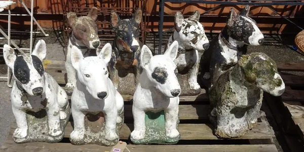 A group of eight 20th century painted reconstituted stone Staffordshire bull terriers, (a.f) (8).   OUT