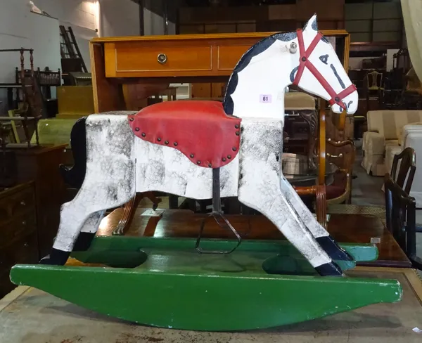 A 20th century wooden rocking horse, 70cm wide x 79cm high.  C9