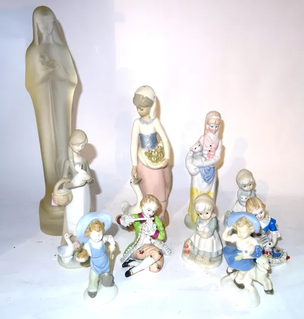 Leerdam, a 20th century frosted glass figure of Madonna and child, 37cm high, together with nine porcelain figure groups.  S2B