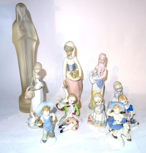 Leerdam, a 20th century frosted glass figure of Madonna and child, 37cm high, together with nine porcelain figure groups.  S2B