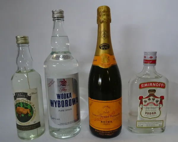 Eleven bottles of Vodka, gin and champagne comprising; Beefeater, White Satin, Hogarth, Gordons, (x2) Smirnoff, a half bottle of Smirnoff, Cracovia, W