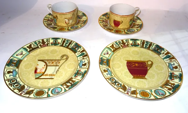 Gucci ceramics, comprising; a pair of 20th century cups and saucers, boxed and two plates boxed, (4).   S2M