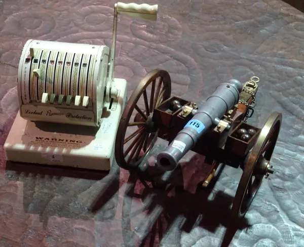 Collectables, including; an early 20th century Paymaster mechanical calculator and a model of a cannon.   S2T