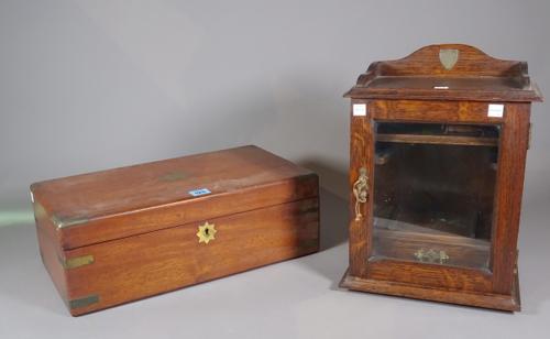An early 20th century mahogany and brass bound writing slope, 46cm wide x 16cm high and an early 20th century oak single drawer smokers cabinet, 27cm
