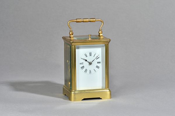 A French brass cased carriage clock by Couilliant, circa 1880, push button, repeat strike, with visible escapement, two train movement and hammer stri