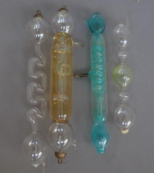 Ten Geissler tubes and six magnifying lenses, some contained in a box detailed ' Steinmann & Co, (qty).