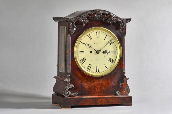 A Regency mahogany cased mantel clock, circa 1820, by White, Strand', with relief carved foliate cornice and plinth base, enclosing a chain driven twi