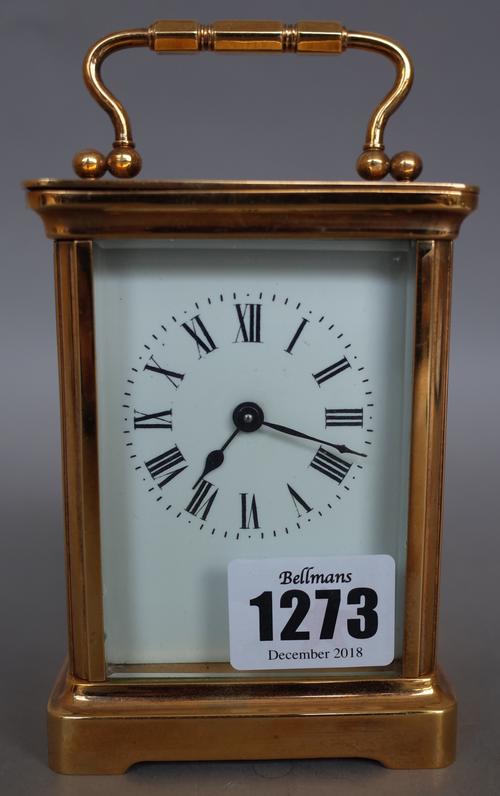 A French R&C brass cased carriage clock, early 20th century, with visible platform escapement and single train movement (11cm, high) with a leather tr