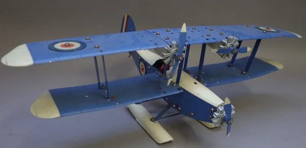 A Meccano No 2 special plane outfit, circa 1930, built as a sea biplane with parts in pale blue and white with RAF roundels, with three engines and fl