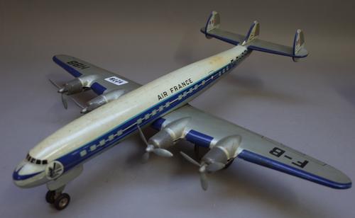 A Joustra (France) 'Super G' tin plate, friction drive aeroplane and an English pre-war tinplate clockwork biplane, the first 47.5cm, (2).