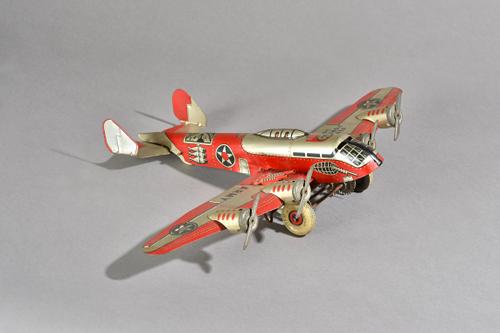 A Marx tinplate clockwork military aeroplane, circa 1940, Flying Fortress 2095', 34cm, boxed. Illustrated.