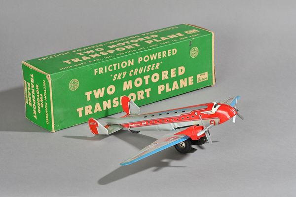 A Marx tinplate 'Sky Cruiser' friction powered transport plane, circa 1950, with siren, 34cm, boxed. Illustrated.