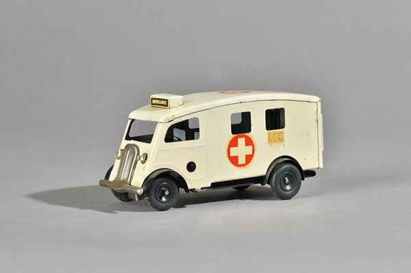 A Triang Minic clockwork Ambulance, No 75M, with 'L.C.C' side decals, boxed. Illustrated.