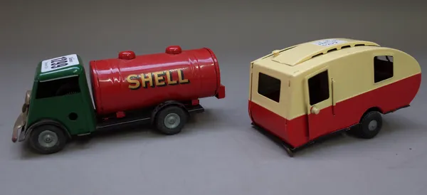 A Triang Minic clockwork 'Shell' petrol tanker, No 15M, dark green cab, red back and a Minic caravan, both boxed, (2).