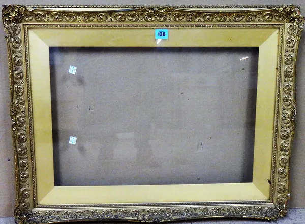A 19th/ 20th century gilt plaster swept frame and slip, glazed aperture, 37cm x 54cm.    M5
