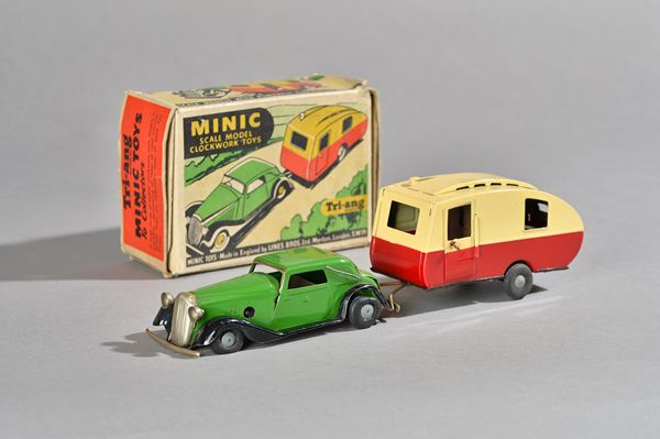 A Triang Minic clockwork Caravan & Vauxhall cabriolet, green livery and black wings, boxed. Illustrated.