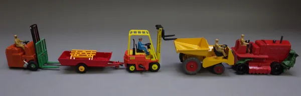 Seven Dinky commercial and agricultural die-cast vehicles and accessories comprising; 563 Heavy Tractor, 320 Harvest Trailer, 27H Disc Harrow, 794 Loa
