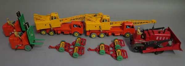 Ten Dinky toys commercial die-cast vehicles, comprising; two 571 Coles Mobile Cranes, two 561 Blaw-Knox Bulldozers, two 972 20-ton Lorry Mounted Crane