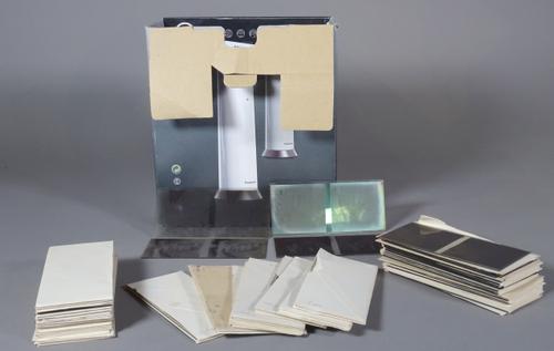 A quantity of early 20th century unmarked glass stereoscopic sides, mixed subjects including dentistry, (qty).   CAB