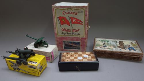 A quantity of collectable toys including; a wooden puzzle map of France dated 1875 in a wooden case (51cm wide), a Pelham standard 'Skeleton' puppet,