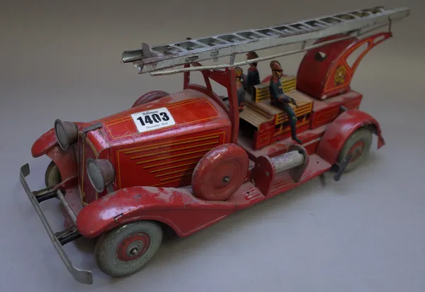 A French tinplate fire engine by Unis of France, pre-war, with mechanical movement, indistinct stamp, 41cm wide (a.f).