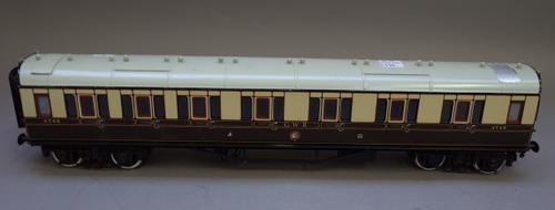 A quantity of O gauge rolling stock and accessories, pre-war, including a Hornby 0-4-0 LNER Locomotive, a GWR passenger coach, various wagons and an e