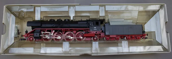A Fleischmann OO gauge locomotive and tender, No 64138, boxed.