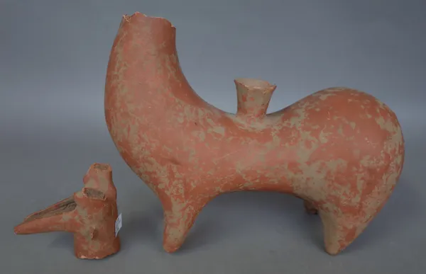 A Persian terracotta Rhyton, possibly a horse or stag, lacking head, 28cm wide.