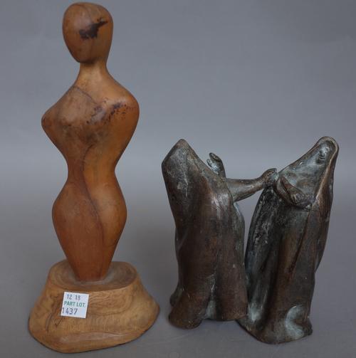 A patinated bronze depicting two stylised cloaked figures, unsigned, 14cm high and an abstract carved wooden figure on a naturalistic base, 23cm high,