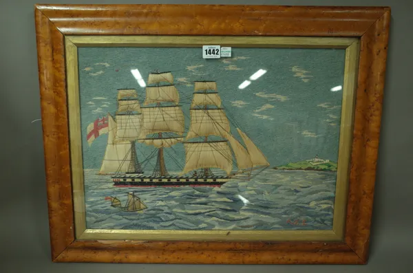 A woolwork ship picture depicting a 19th century warship, fully rigged at sea with land behind 48cm x 36cm, framed and a needle work portrait of a lat