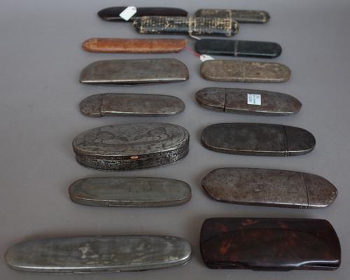 A folding steel spectacles case engraved 'George Horne Baxter 1762', 13.2cm, another converted, engraved to the oval hinged lid with a pheasant, six f