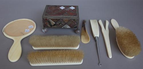 A late 19th century smoky agate casket of sectional rectangular form raised on four spherical agate feet, 15cm wide, an early 20th century part ivory