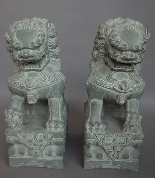 A pair of modern stone Chinese lions or 'Dogs of Fo', seated on a foliate carved base , 31cm high and a modern pottery Chinese 'Terracotta army' soldi