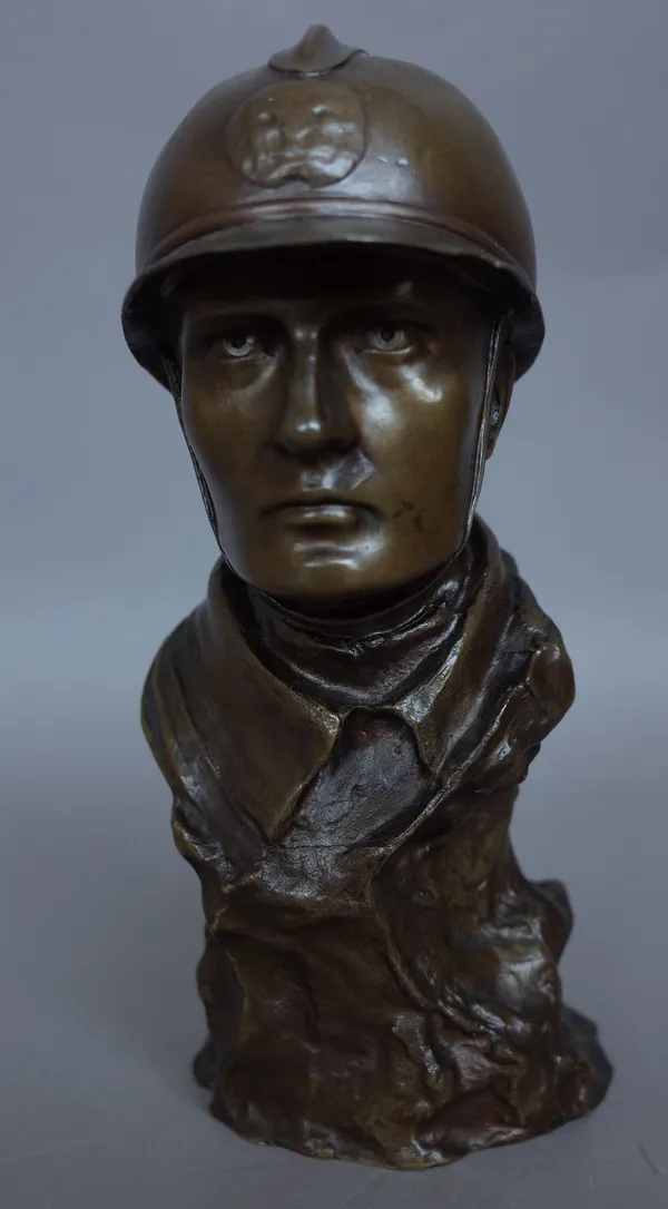 A Belgian bronze bust of a fireman, circa 1900, signed 'HOLEMANS' to the cast, 20.5cm high.