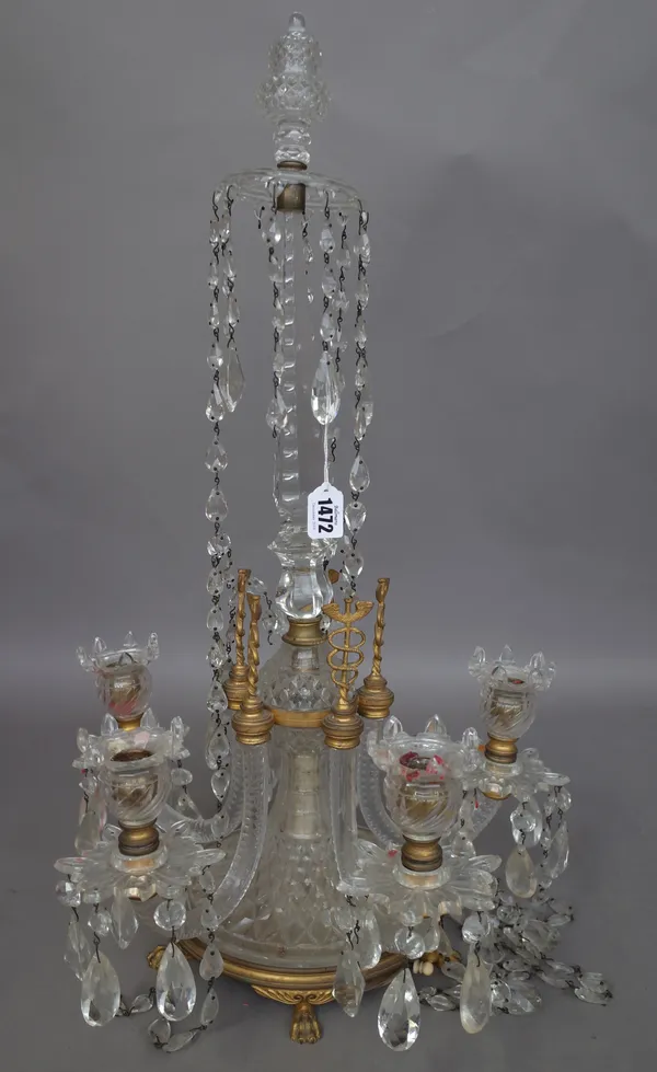 A late 19th century French cut glass five branch candelabra and a single cut glass wall light, each hung with shaped drops, the first 64cm high, (a.f.