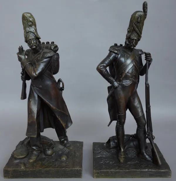 A French bronze figure of a French soldier, late 19th century, standing, leaning on his rifle on a naturalistic base titled 'Decembre 1805', 38.5cm hi