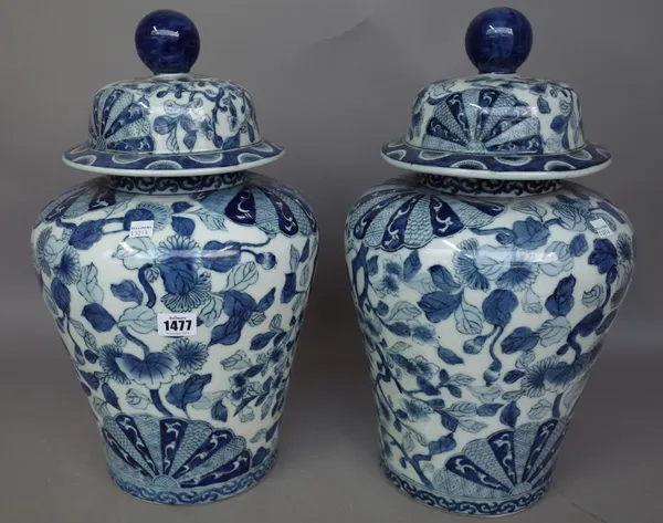 A pair of modern Chinese blue and white vases and covers, decorated all over with flowers, 46cm high and another pair of modern Chinese famille verte