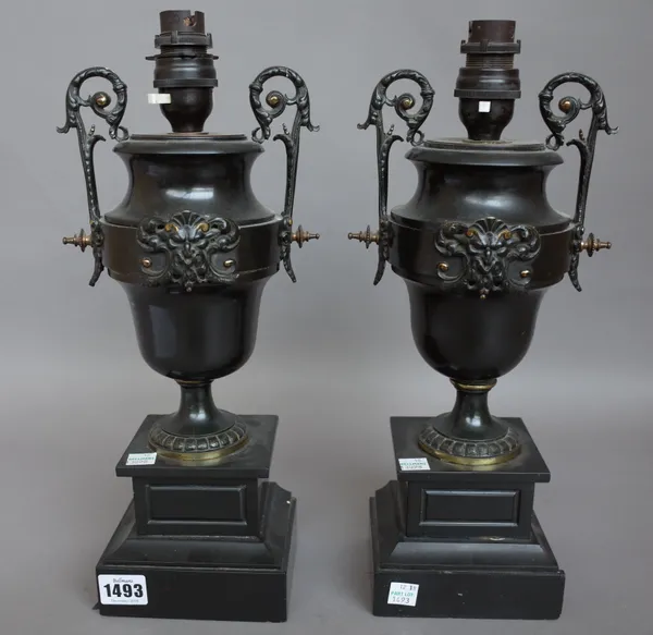 A pair of black slate, marble and ormolu mounted urns 19th century (converted to table lamps), each on stepped square base. (a.f.) 34cm high, (2).