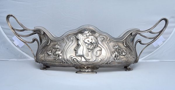 A WMF figural plated pewter Art Nouveau twin handled centrepiece with detachable glass liner, stamped maker's marks, circa 1900, 60.5cm wide across th