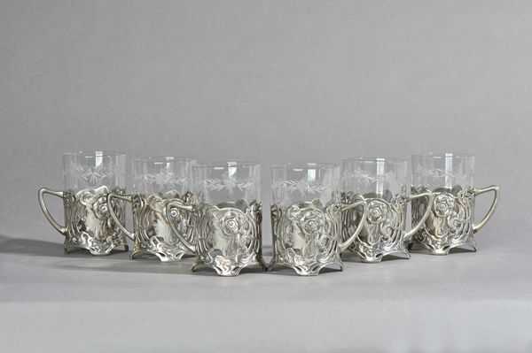 A set of six WMF pewter Art Nouveau figural drinking glasses stamped maker's marks, circa 1900, 10.5cm high, (6). Illustrated.