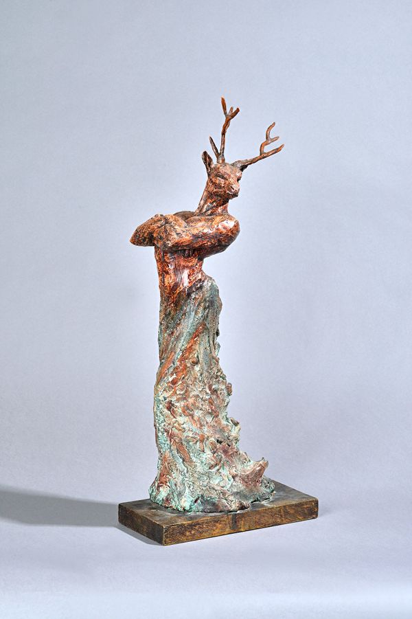 A terracotta anthropomorphic figure, late 20th century, polychrome decorated and detailed with a stags head and male torso blending into naturalistic