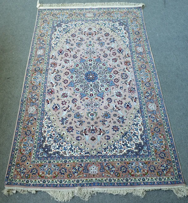 A Nain rug, Persian, the pale grey / pink field with a faceted medallion, matching spandrels, all with delicate floral sprays, a darker border with pa