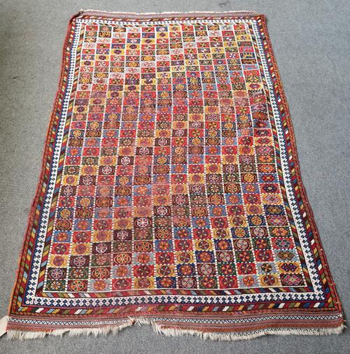 A North West Persian rug with repeating polychrome hooked medallions, 240cm x 144cm and another rug, chichi style 224cm x 136cm, (a.f), (2).